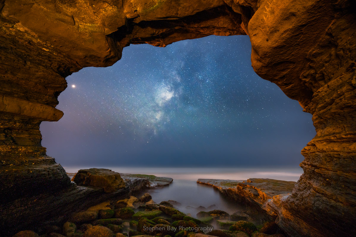 The Milky Way core viewed from a sea cave