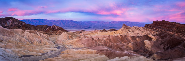 Panoramic view of Zabriskie Point in Death Valley shows the rough ridges and valleys in the terrain.