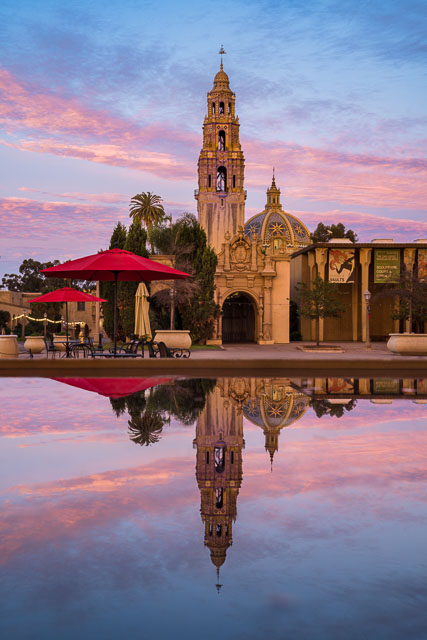 The California tower and dome in Balboa Park reflected into a pool of water.