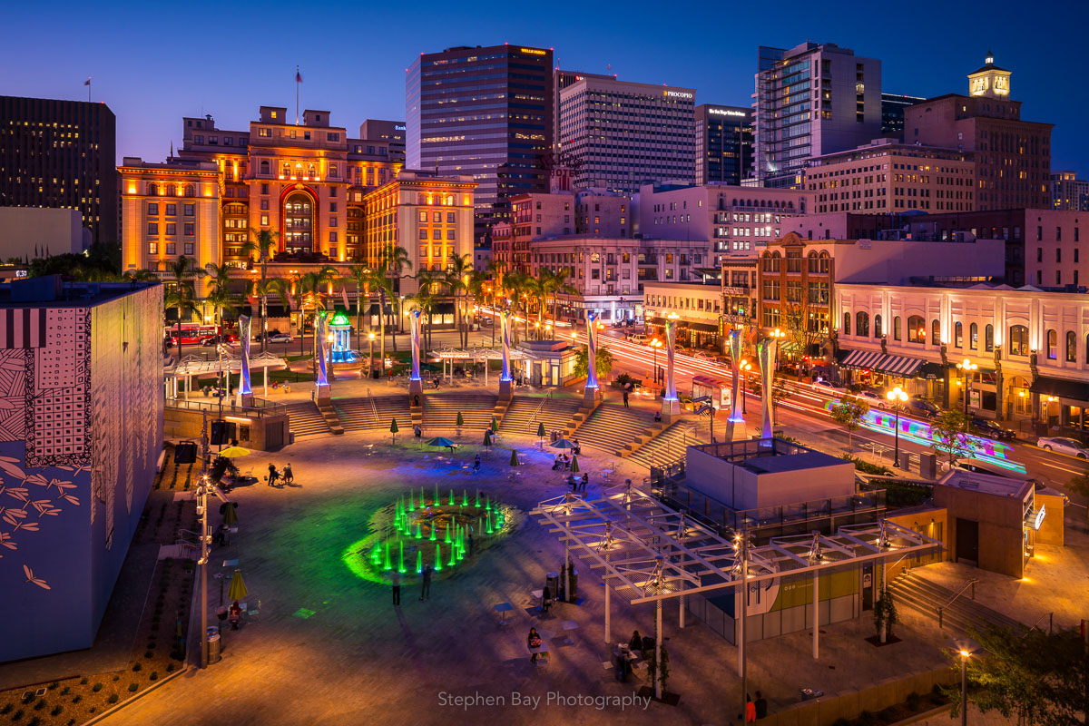 An aerial view of Horton Plaza Park at night as people in the city go about their business.