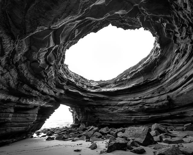 A giant open ceiling cave in the Sunset Cliffs neighborhood of San Diego.