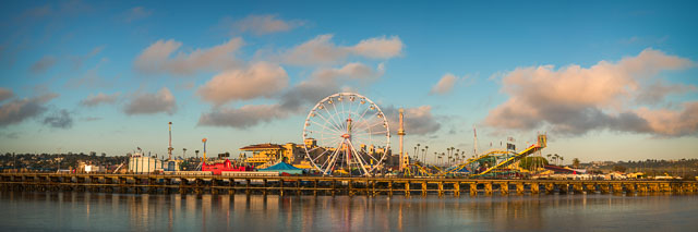 A panorama of the San Diego county fair showing all of the rides including a giant ferris wheel.