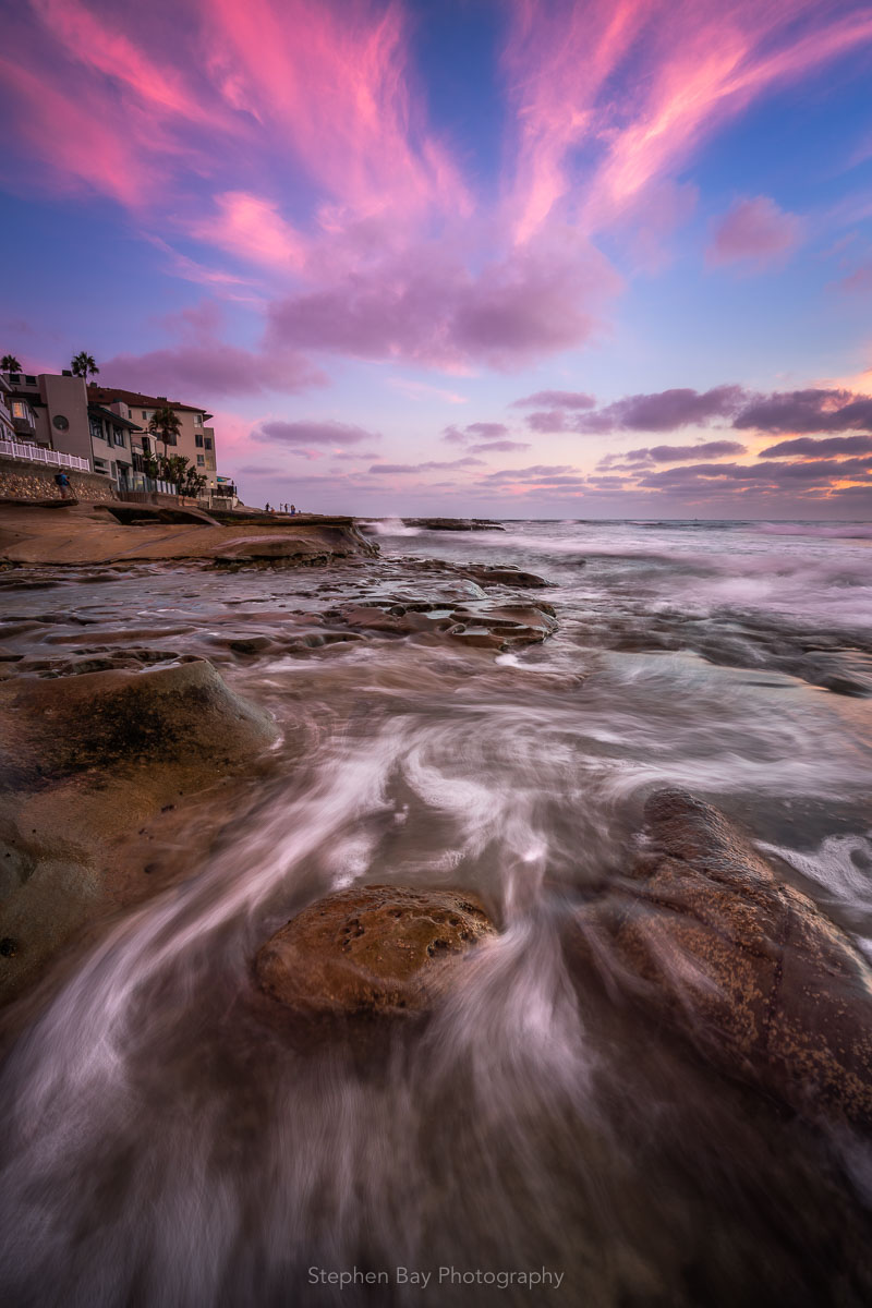 Sunset on the La Jolla coastline. The movement of the water reflects the motion and position of the clouds.
